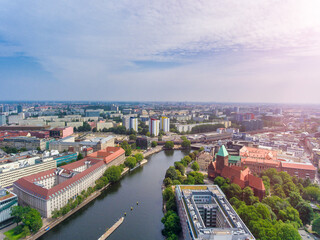 Fototapeta na wymiar Aerial view of Berlin cityscape from drone in summer season with city landmarks and blue sky, Germany
