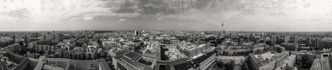 Panoramic aerial view of Berlin skyline at sunset with major city landmarks along Spree river,...