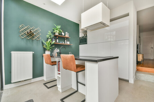 Stylish kitchen with dining table and chairs