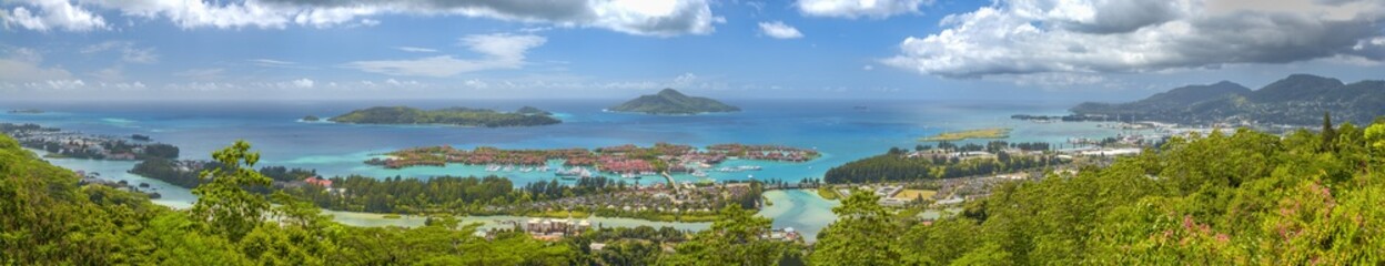Fototapeta na wymiar Panoramic aerial view of Eden Island and Mahe seascape from the hill at sunset, Seychelles.