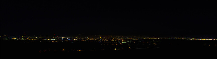 Panoramic view to city Ceske Budejovice at night with dark sky. Czech republic, long exposure