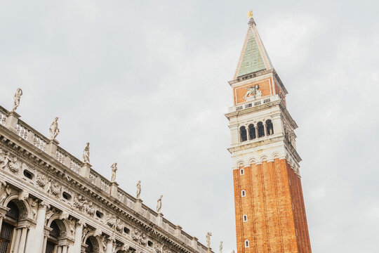 Facade of St Marks Campanile with spire against cloudy sky