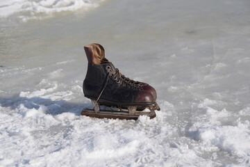 old hockey skates on ice background - 481228115