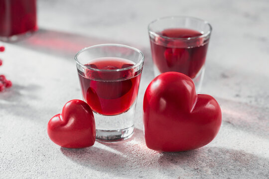 Red cocktail, vodka or liqueur and Heart shape decorations