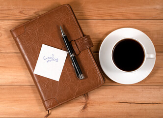 Cup of coffee and notepad