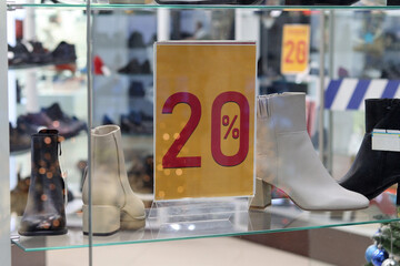 Shop sign 20%, discounts on women's shoes, sale