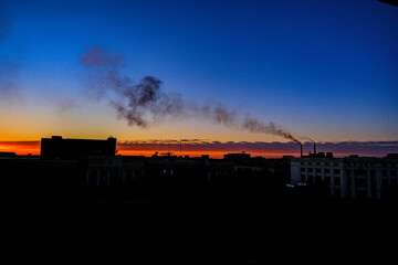 The city in summer at sunset