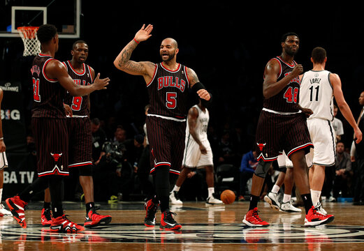 Chicago Bulls' Boozer, Deng, Butler and Mohammed celebrate against the Brooklyn Nets in the second half of their NBA basketball game in New York