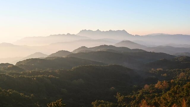 Scenery of Doi Kham Fah viewpoint with sunrise over Doi Luang Chiang Dao mountain with foggy in tropical rainforest at national park