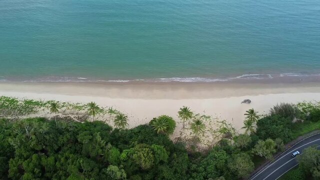 Aerial down view senic road next to beach