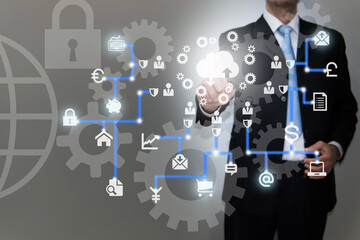 Businessman using modern computer, pressing button on virtual screen. Icons cloud technology and networking concept. Connecting to world wide network