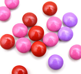 sugar coated pills on white background