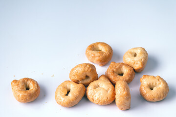 salty round cookies on a white background, space for text, close-up