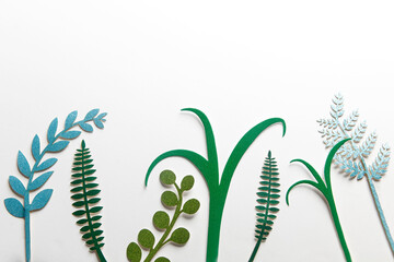 paper cut tropical leaves are on the white background