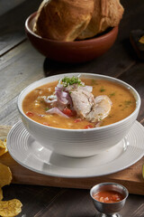 Encebollado, fish stew, served with banana and lemon fries. A typical Ecuadorian dish, Ecuadorian gastronomy
