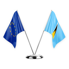 Two table flags isolated on white background 3d illustration, european union and saint lucia