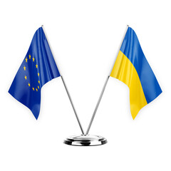 Two table flags isolated on white background 3d illustration, european union and ukraine