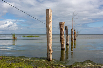 wood fence in sea water calm landscape