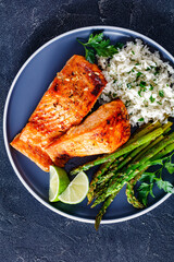 fried salmon fish fillet with rice and asparagus