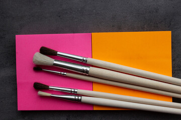 Paint brushes and paints for drawing.