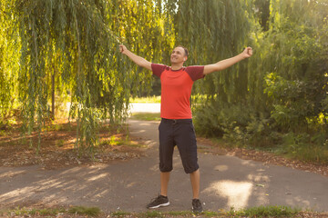 happy man in a park. Healthy lifestyle concept