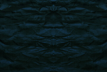 Fototapeta premium Abstract dark blue mirrored background of a torn paper