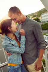 You're the reason I smile. Shot of a happy young couple enjoying a romantic moment in the city.