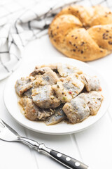 Chopped marinated fish. Salted herring