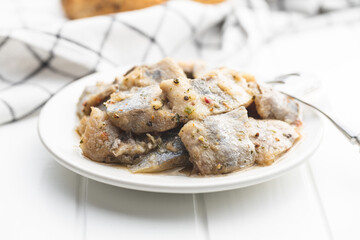 Chopped marinated fish. Salted herring