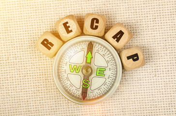 On the table is a compass and cubes with the inscription -REACT