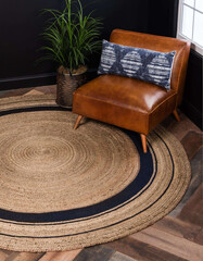 Modern rounded natural jute living area rug.