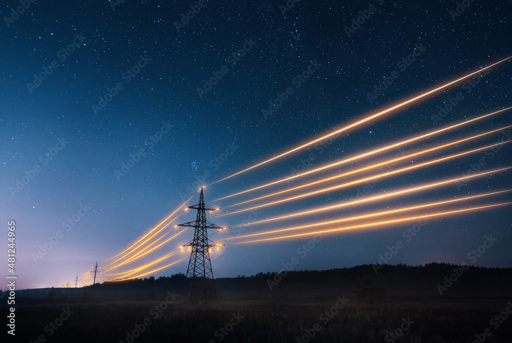 Wall mural electricity transmission towers with orange glowing wires the starry night sky. energy infrastructur