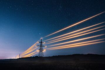 Electricity transmission towers with orange glowing wires the starry night sky. Energy infrastructure concept. - obrazy, fototapety, plakaty