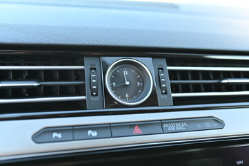 Obraz na płótnie Canvas the clock control unit in the car interior of the car