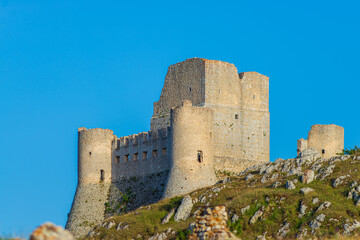 Fototapeta na wymiar Castle ruins at Rocca Calascio italian travel destination, landmark in the Gran Sasso National Park, Abruzzo, Italy. Clear blue sky