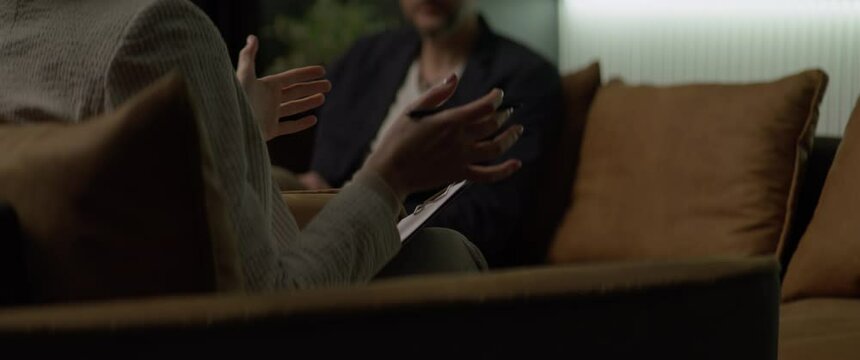 CU Psychologist making notes during an appointment with a client. Shot with 2x anamorphic lens