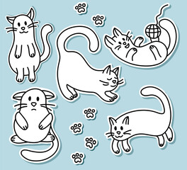 Collection of stickers with a drawn contour cute cat on an isolated blue background