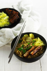 Curry soup with noodles and brased tofu