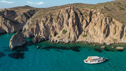 Obraz premium Aerial drone photo of beautiful emerald crystal clear beach and rocky bay of Plathiena, Milos island, Cyclades, Greece