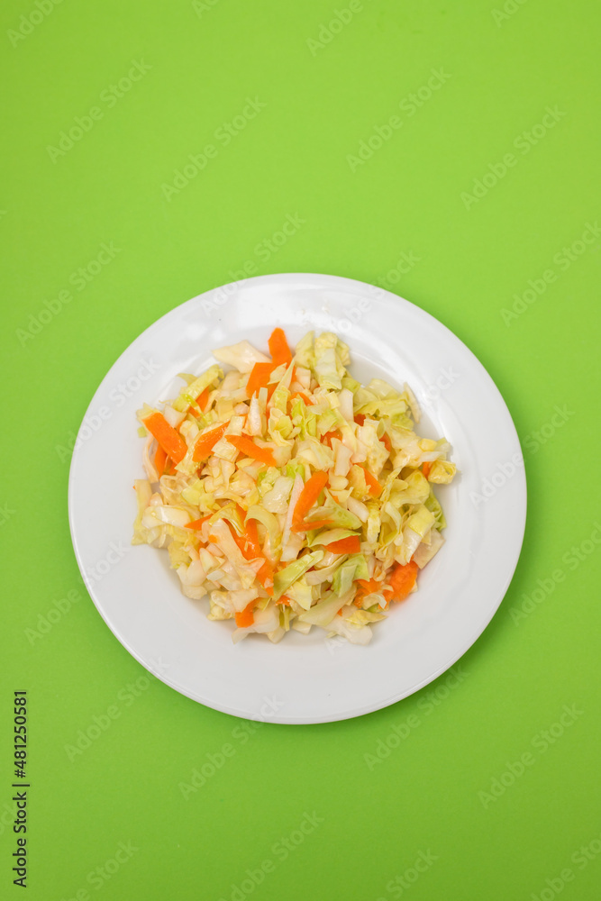 Poster salad fresh cabbage with carrot on white dish