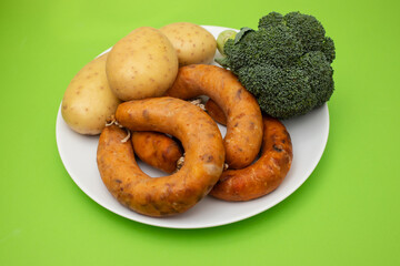 smoked portuguese sausage alheira on white dish