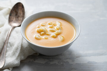 vegetable soup with pasta in white bowl