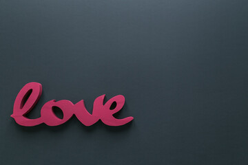 Red Love sign on the black background