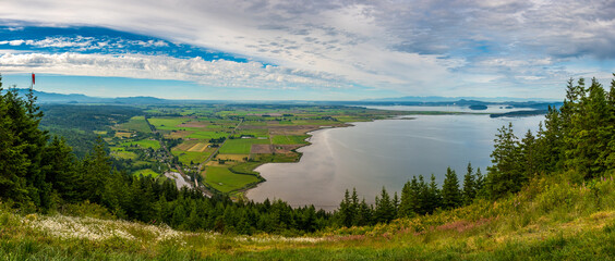 A panoramic view of Skagit Bay and farmlands as seen from the view point at Oyster Dome hiking trail