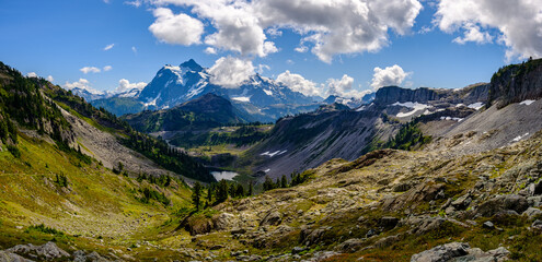 A panoramic view of Mt. Baker and its surroundings as seen from a hiking trail