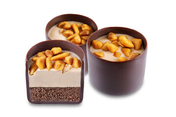 Dark chocolate nut cream roasted nuts candy on a white isolated background