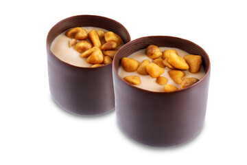 Dark chocolate nut cream roasted nuts candy on a white isolated background