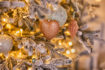 Gold Christmas background of de-focused lights with decorated tree