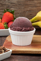 Frozen açaí in a white bowl, selective focus.