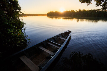 Sunset landscape at the amazon jungle, with water reflections